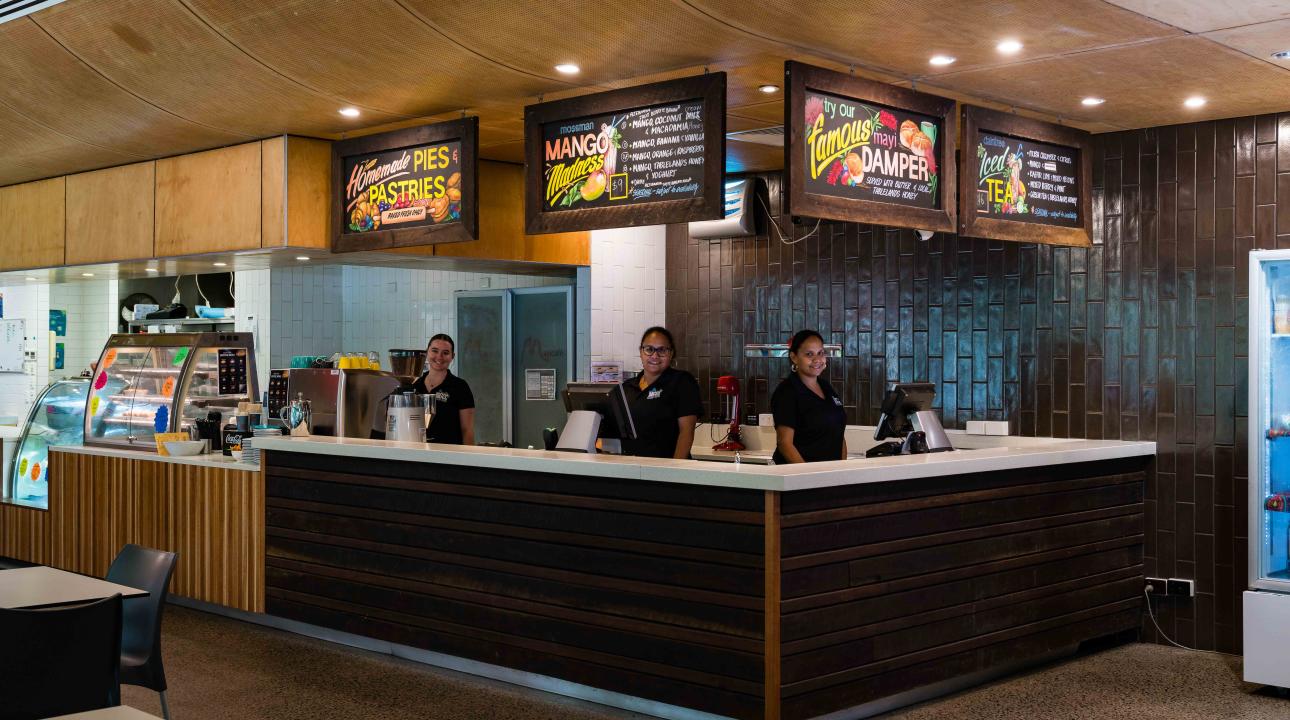 A wide shot of the staff standing in the Mayi Cafe and Rastaurant at Mossman Gorge Cultural Centre