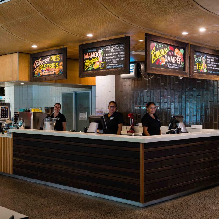 A wide shot of the staff standing in the Mayi Cafe and Rastaurant at Mossman Gorge Cultural Centre