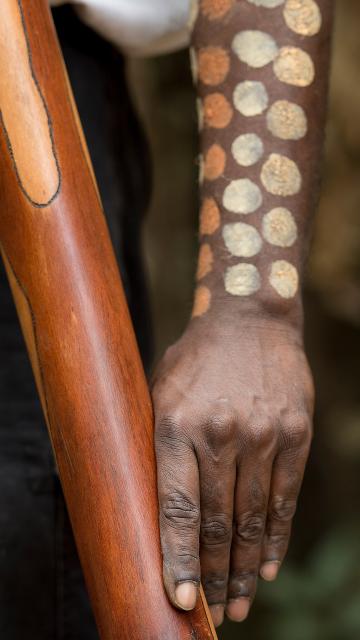 Indigenous individual with tribal painting on skin