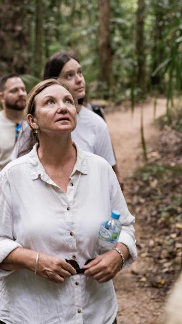 Guide taking a group on the Dreamtime Walk through Mossman Gorge