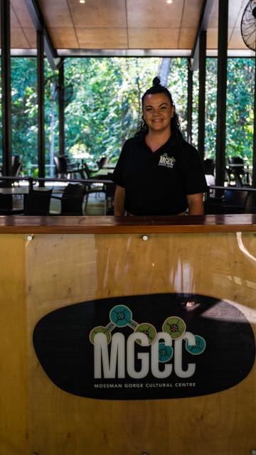 MGCC Staff member standing at MGCC desk in Mayi Cafe and Restaurant