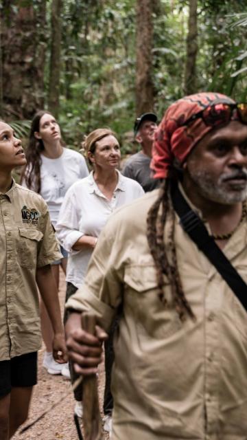 A Kuku Yalanaji guide leading guests on a Dreamtime Walk at Mossman Gorge Cultural Centre, in the Daintree Rainforest